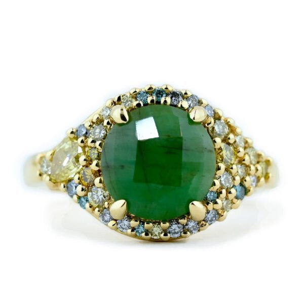 Emerald ring with diamond pavers