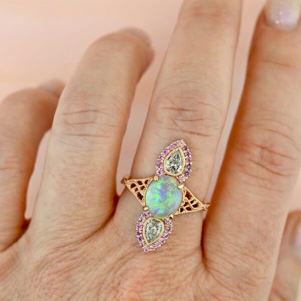 opal-and-pink-sapphire-fairy-ring-aura-on-a-hand