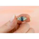 celestial-teal-blue-diamond-engagement-ring-nebula-in-hand