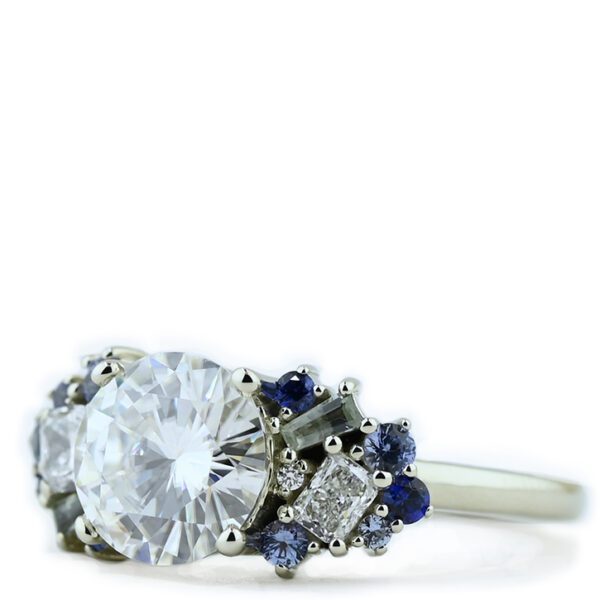 round-moissanite-with-sapphire-accent-engagement-ring-wings-right-profile.jpg