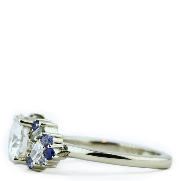 round-moissanite-with-sapphire-accent-engagement-ring-wings-right-side.jpg