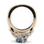 unicorn-sapphire-blue-montana-sapphire-and-pink-champagne-diamond-intricate-ring-through-finger