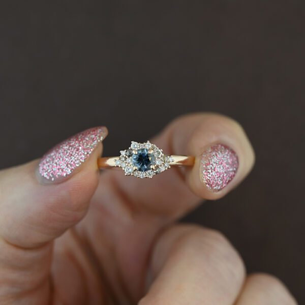 dainty-light-blue-sapphire-and-diamond-cluster-ring-river-rock-in-hand